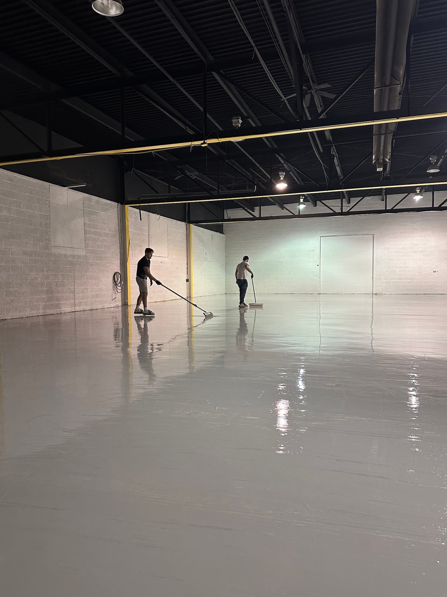 Commercial floor coating installation in progress