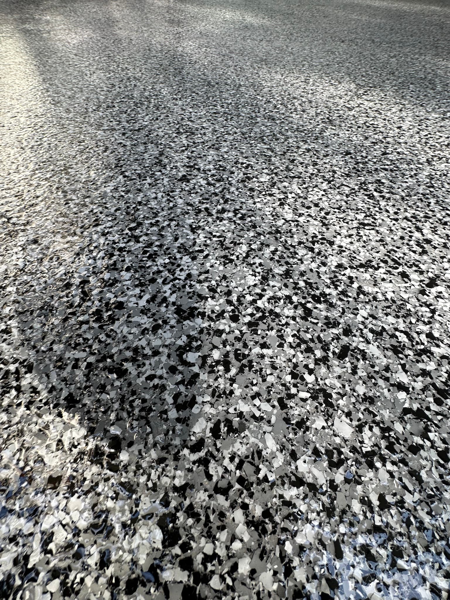 Glossy grey flake floor surface detail