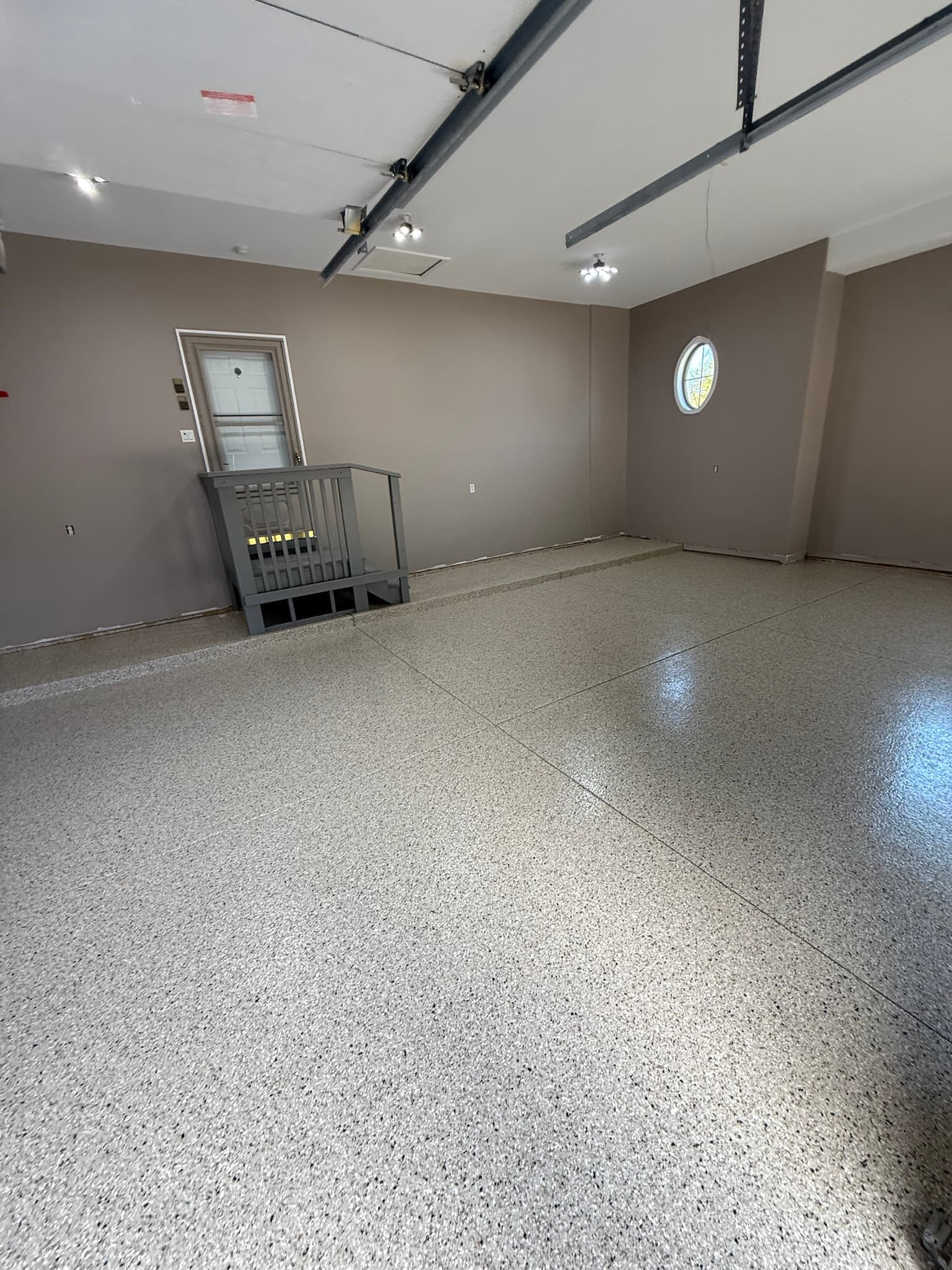 Grey flake floor against taupe garage walls