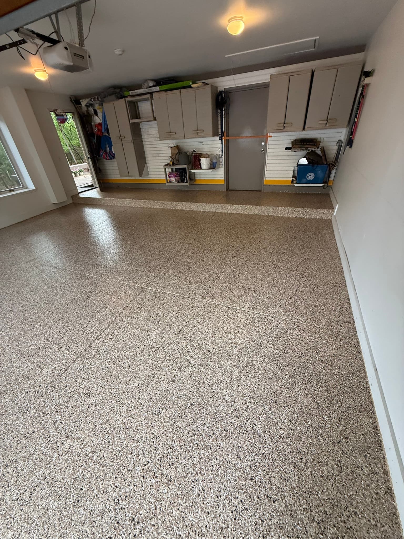 Tan garage floor in natural door light