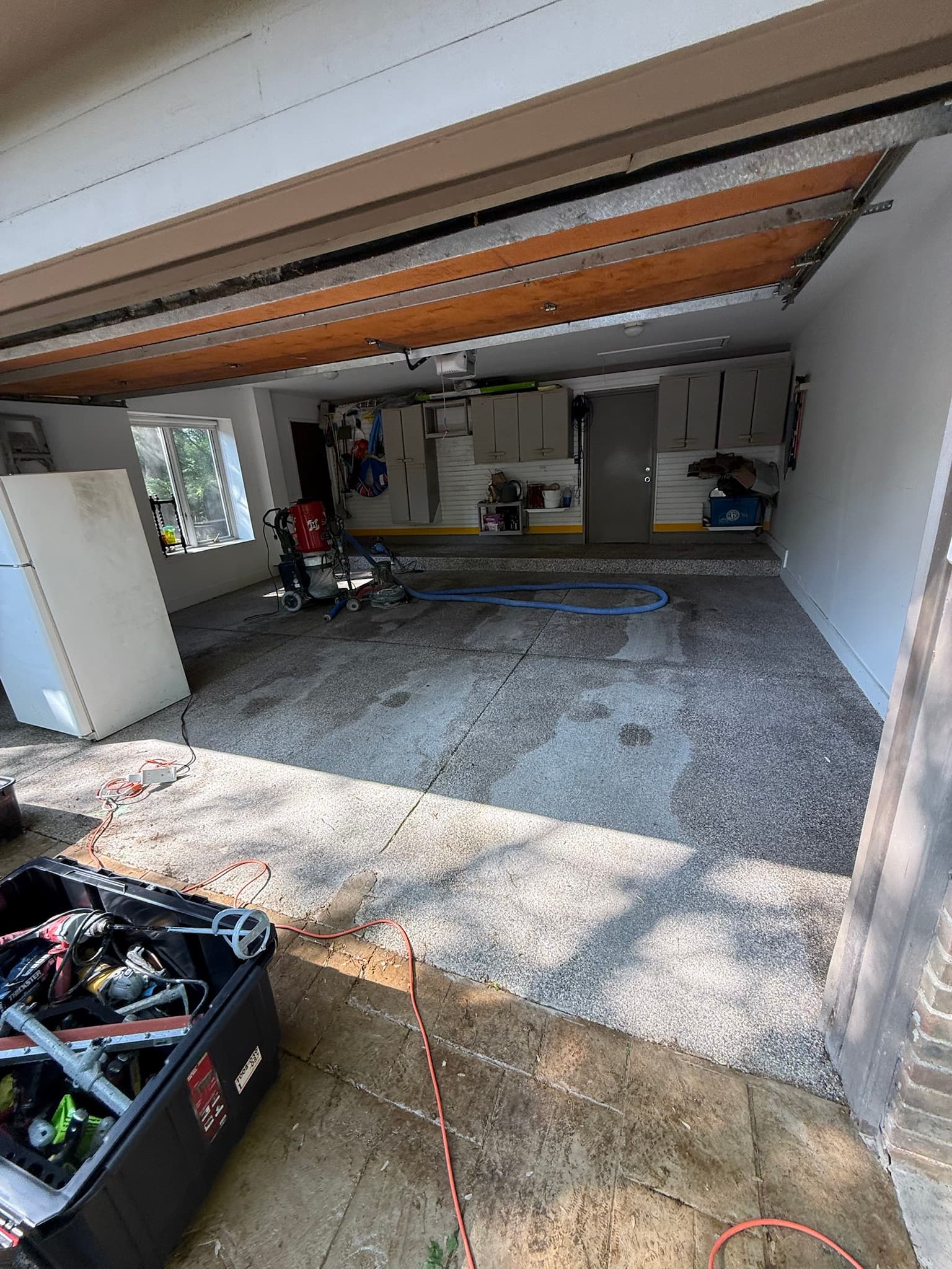Tan flake garage floor coating in progress