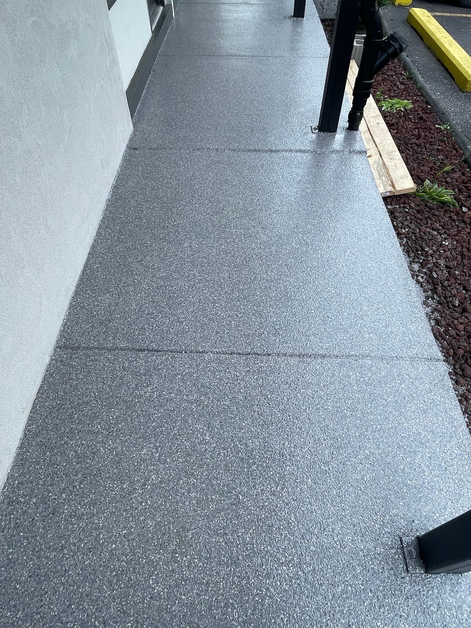 Coated exterior walkway