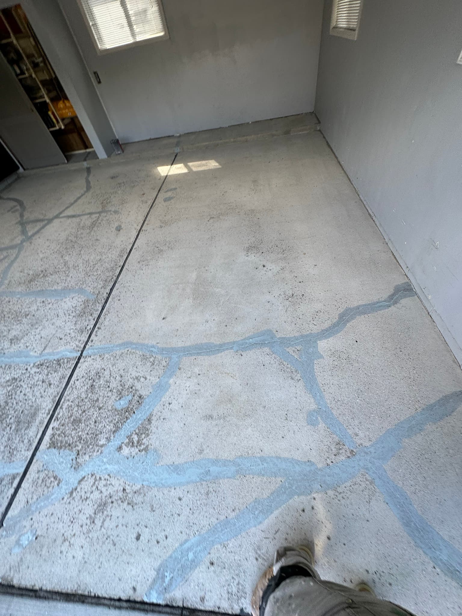 Repairing concrete cracks before coating