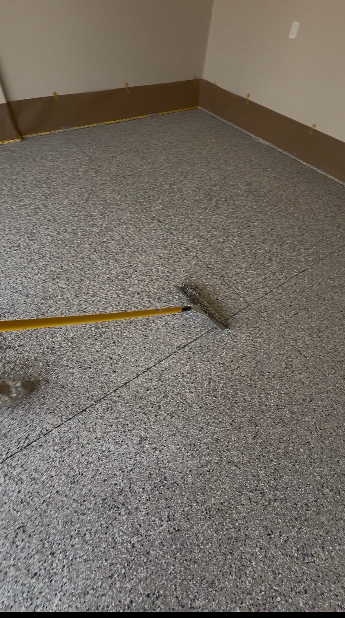 Broadcasting decorative flake across a fresh coat