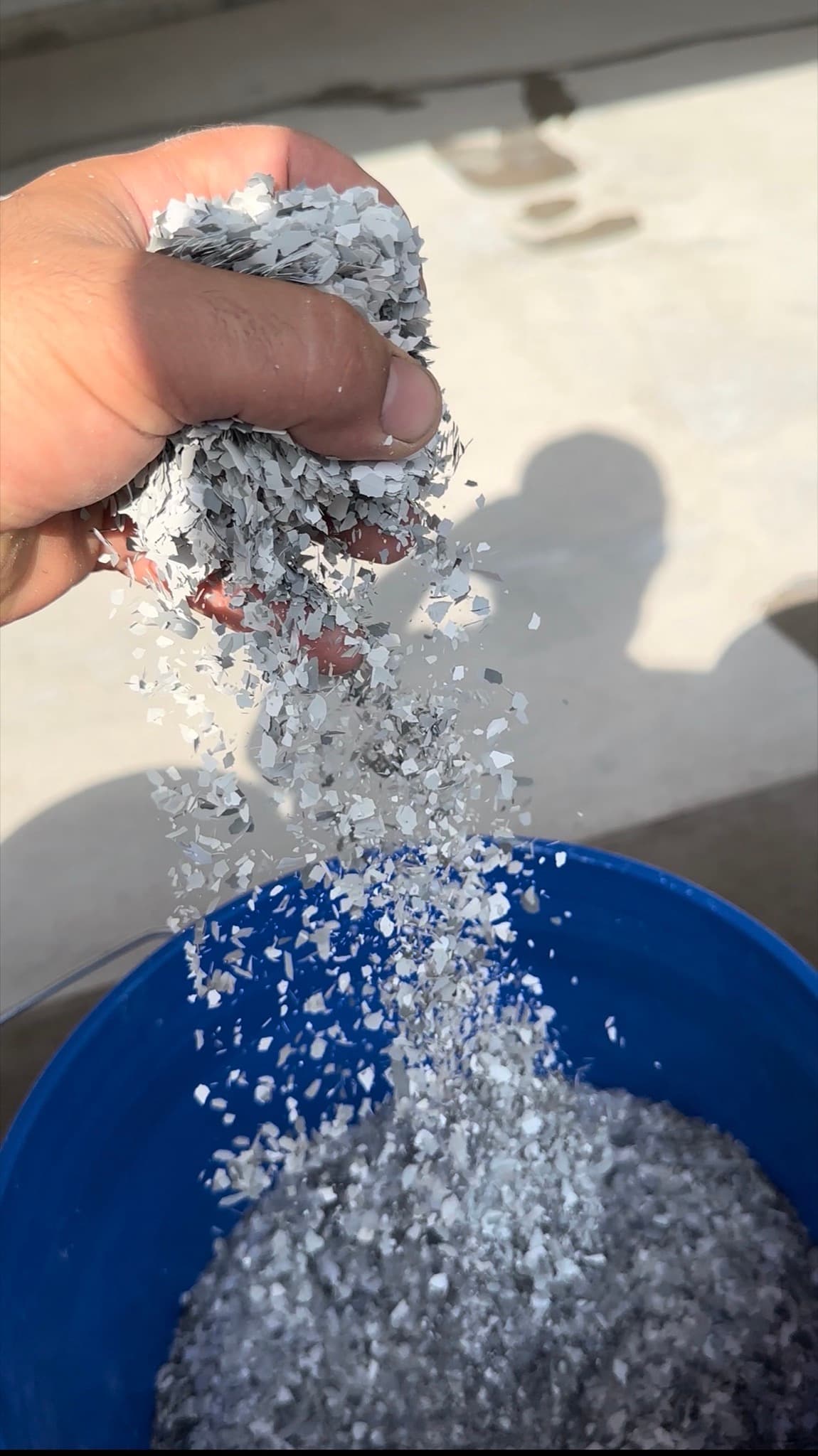 Pouring decorative flake from a bucket